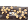 Tavoletta di Cioccolato Fondente e Nocciole 100g 2 La Tavoletta di Cioccolato Fondente e Nocciole 100g nasce dall’incontro tra l’intensità del cioccolato fondente extra e il gusto autentico della Nocciola Piemonte IGP.
